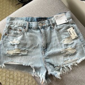 Vintage high rise shorty shorts, ripped light blue jean in a size 2.